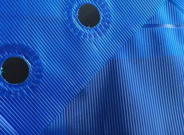 Multi-layered cross-laminated (MLC) tarpaulins